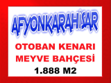 afyonkarahisar da otobanın yanı başında yerleşim merkezine 650 metre mesafede damla su sistemli 1.888 m2 kiraz bahçesi